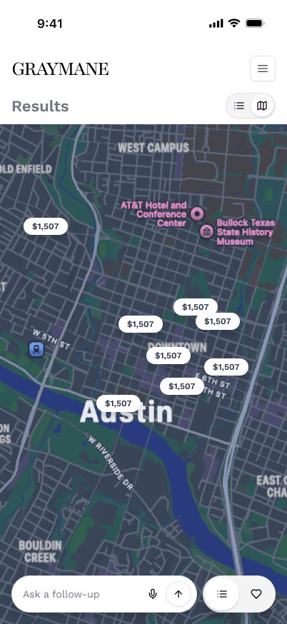 Full-bleed geographic layout interface with a persistent conversational input bar